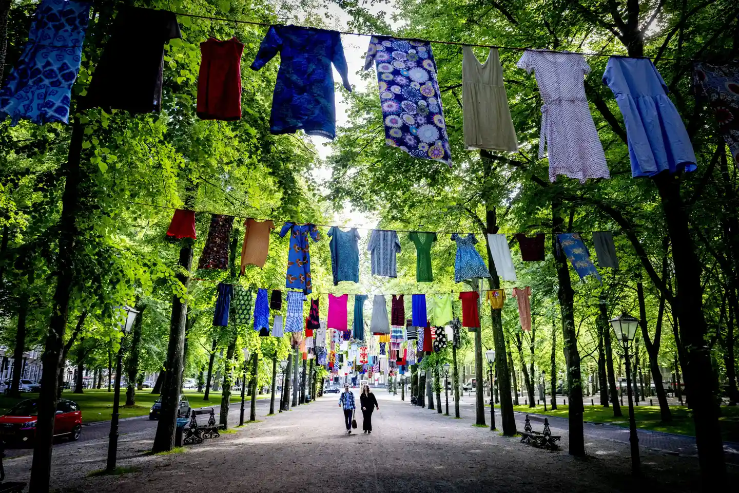 The Guardian's photo of the day, showing the hundreds of dresses hung from the trees of the Lange Voorhout.